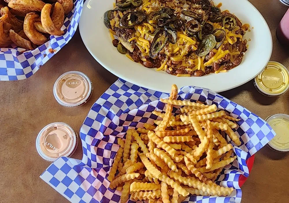 Chili Cheese Burger with Grilled Jalapeño Onion Sour Cream and Fries
